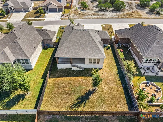 an aerial view of a house with swimming pool
