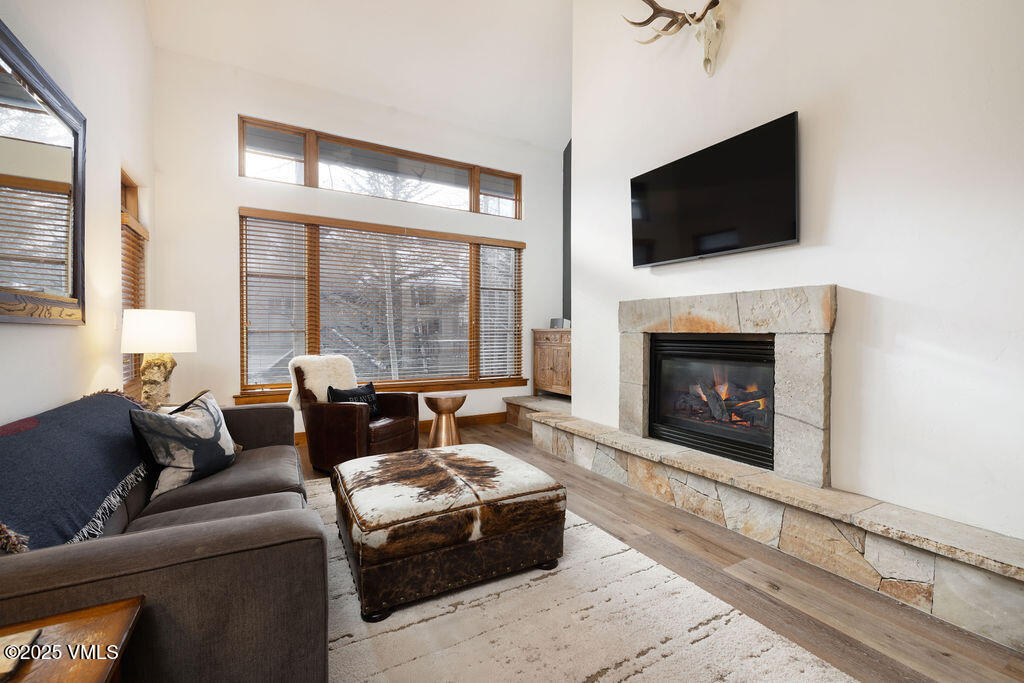 30 Cresta Road, Unit 308 Edwards, CO 81632 - Photo 2 of 9 a living room with fireplace furniture and a flat screen tv