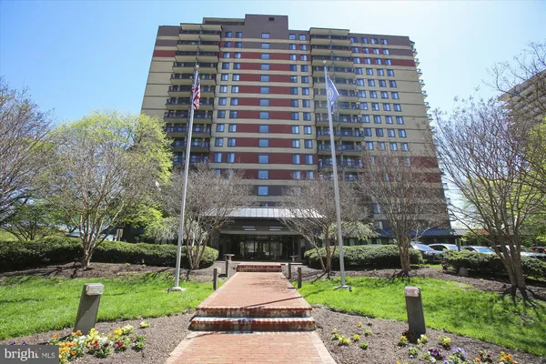 a front view of a building with garden