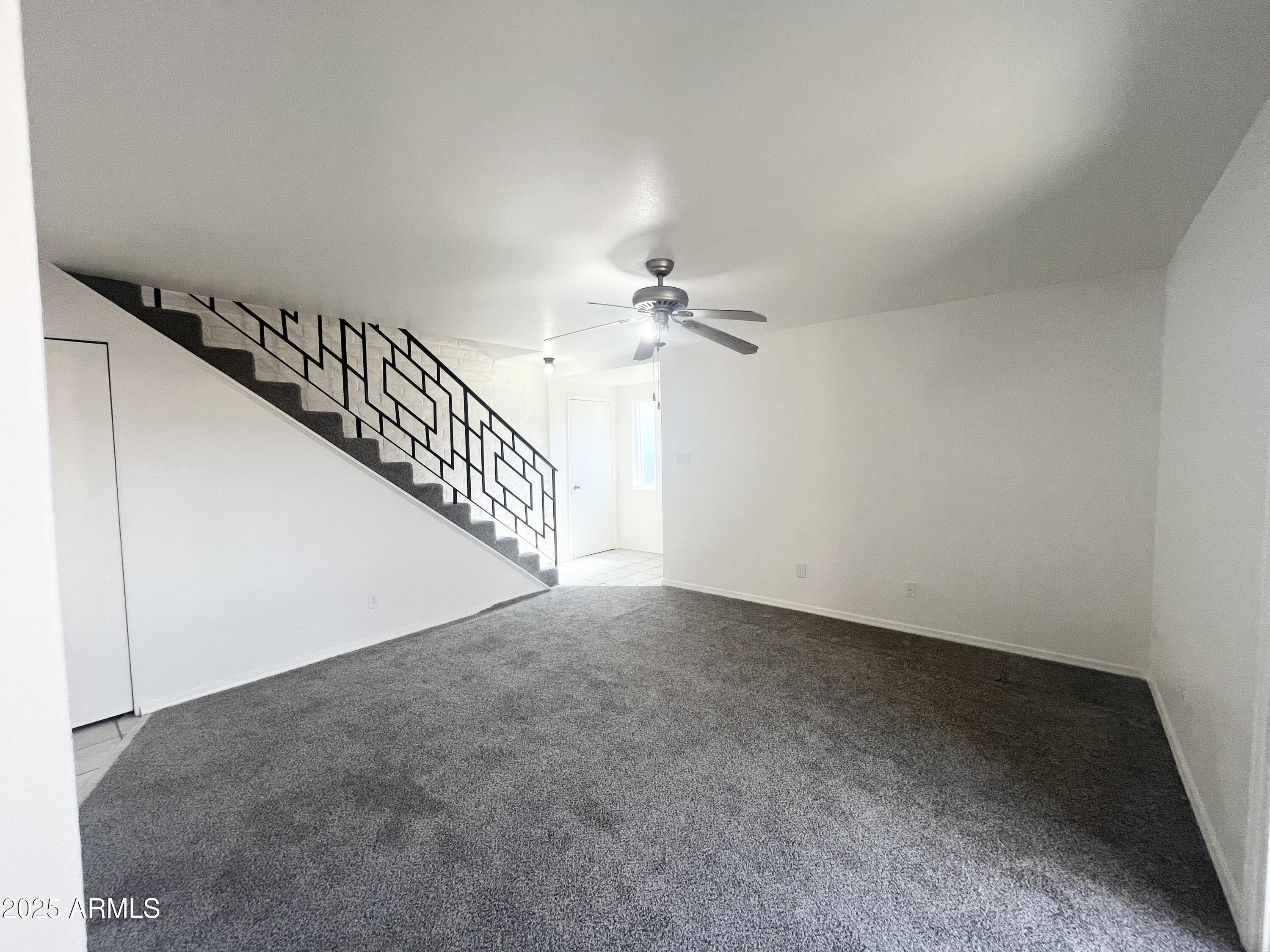 2075 11th Street Douglas, AZ 85607 - Photo 4 of 34 a view of a hallway with a chandelier