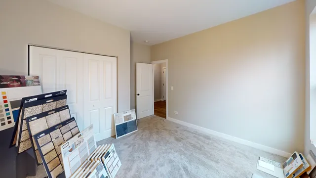 a view of a room with wooden floor and bathroom