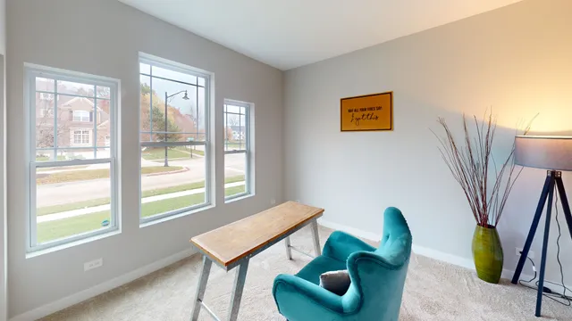 a view of a livingroom with furniture and a window