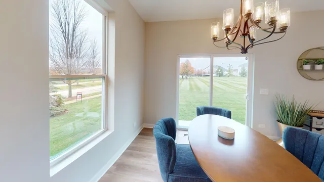 a view of a dining room with furniture window and outside view