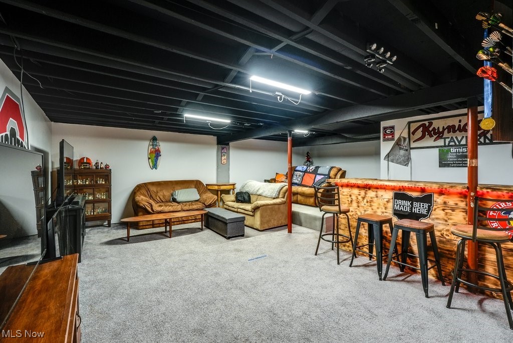 3066 Prior Road Akron, OH 44319 - Photo 25 of 50 Basement featuring bar and carpet flooring