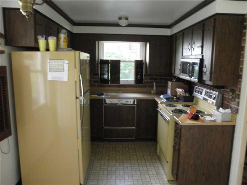 157 Orchard Spring Road Pittsburgh, PA 15220 - Photo 6 of 14 Kitchen. RETRO KITCHEN WITH REFRIGERATOR, ELECTRIC STOVE, MICROWAVE AND DISHWASHER (currently not working). THERE IS ALSO A PANTRY CLOSET FOR MORE FOOD STORAGE.