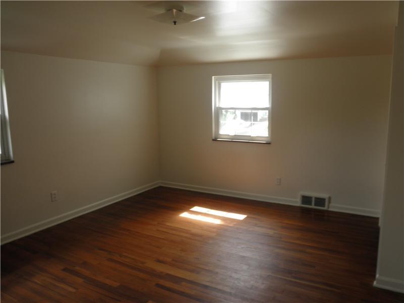157 Orchard Spring Road Pittsburgh, PA 15220 - Photo 7 of 14 Master Bedroom. EXPOSED HARDWOOD FLOOR AND FRESH PAINT