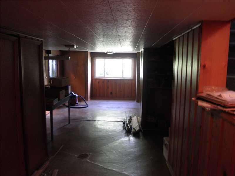 157 Orchard Spring Road Pittsburgh, PA 15220 - Photo 10 of 14 Family Room. LOWER LEVEL IS PARTIALLY FINISHED WITH KNOTTY PINE PANELING AND TILE CEILING. IT S A GOOD START FOR YOUR SPECIAL TOUCHES. LAUNDRY AREA ALSO HERE IN THE LOWER LEVEL.