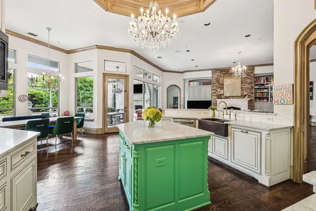a kitchen with sink and refrigerator