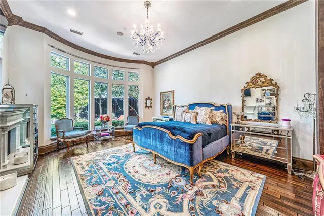 a bedroom with furniture and a wooden floor