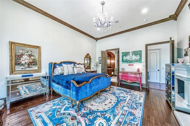 a bedroom with furniture and a flat screen tv