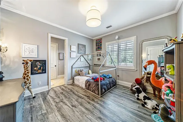 a bathroom with a granite countertop sink and a toilet