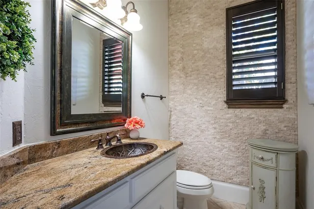 a living room with fireplace furniture and a flat screen tv