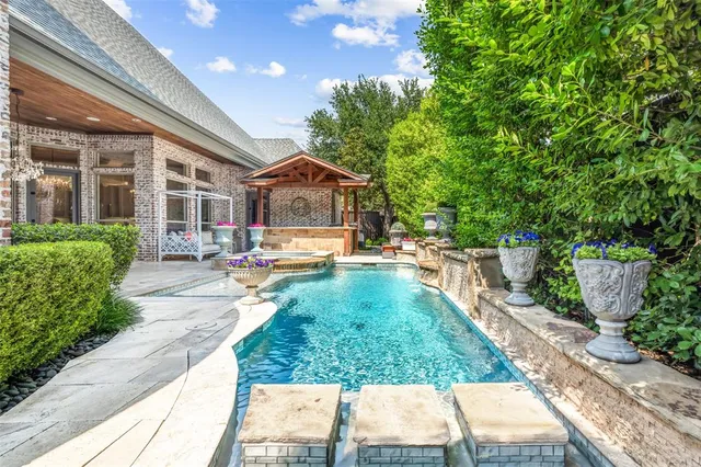 a view of a lake with houses in the back