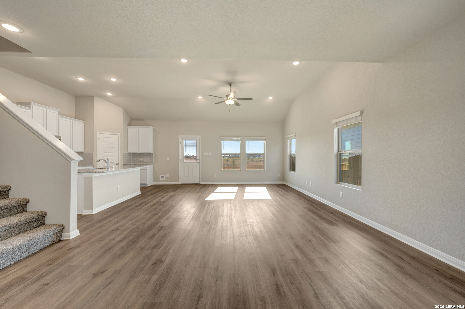 10330 Goodison Drive Converse, TX 78109 - Photo 8 of 42 a view of an empty room with wooden floor and a window