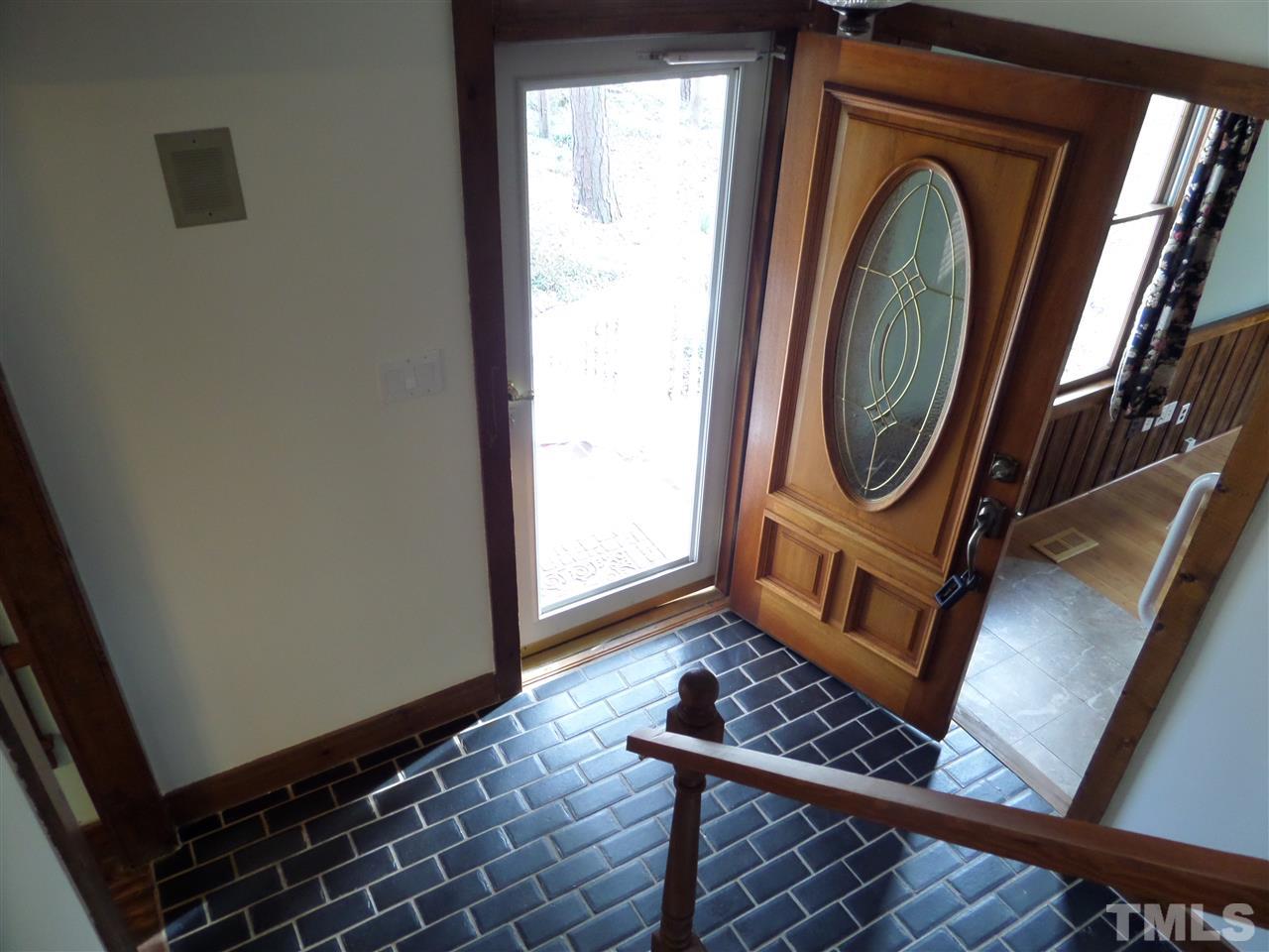 8725 Windjammer Drive Raleigh, NC 27615 - Photo 2 of 25 Foyer is bright open and Welcoming with tile floors
