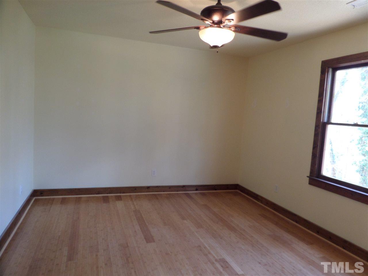 8725 Windjammer Drive Raleigh, NC 27615 - Photo 14 of 25 Front xtra bedroom Bamboo floors