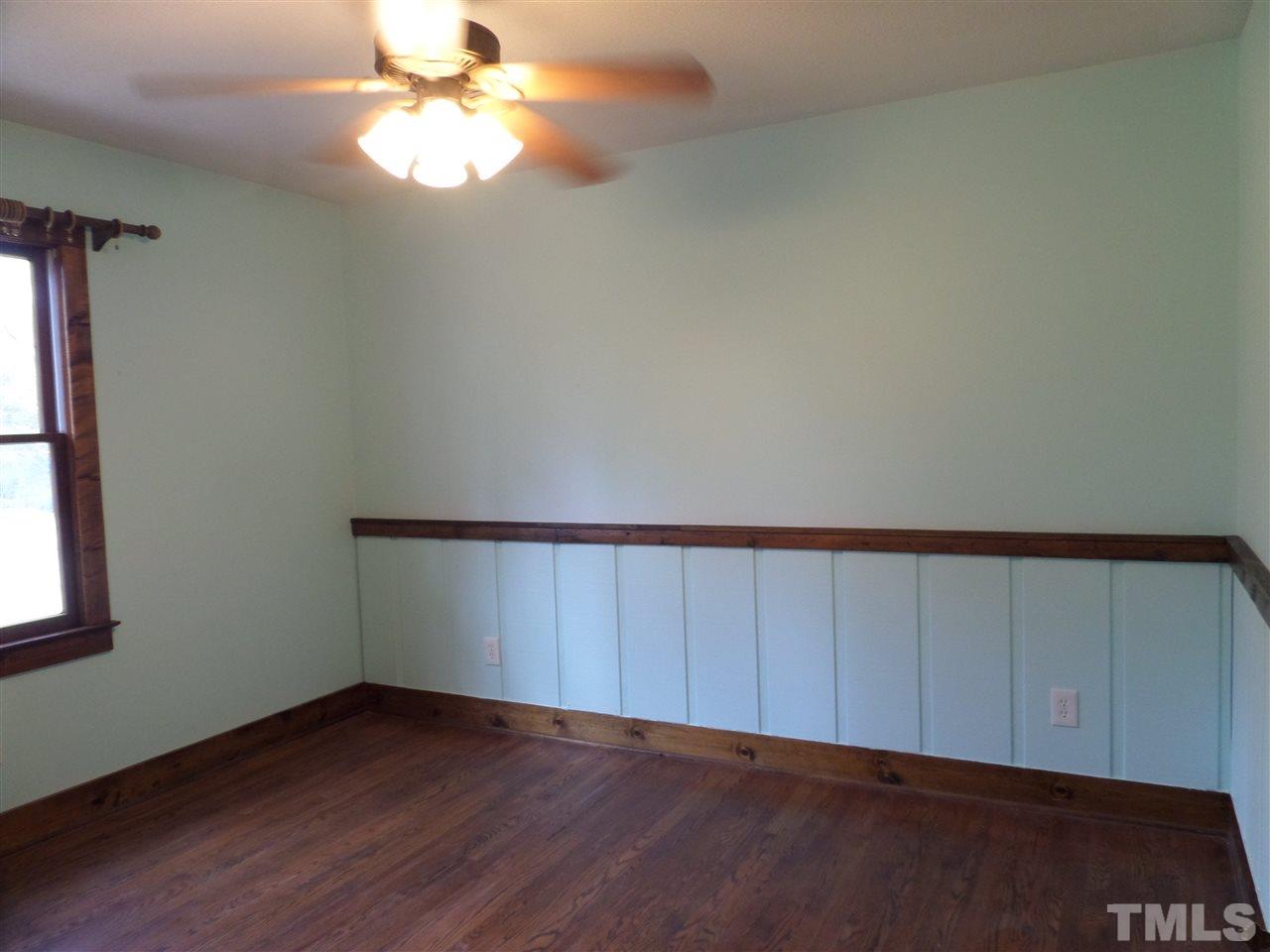8725 Windjammer Drive Raleigh, NC 27615 - Photo 15 of 25 Great xtra bedrm with added chair rail and wainscotting- wood floors