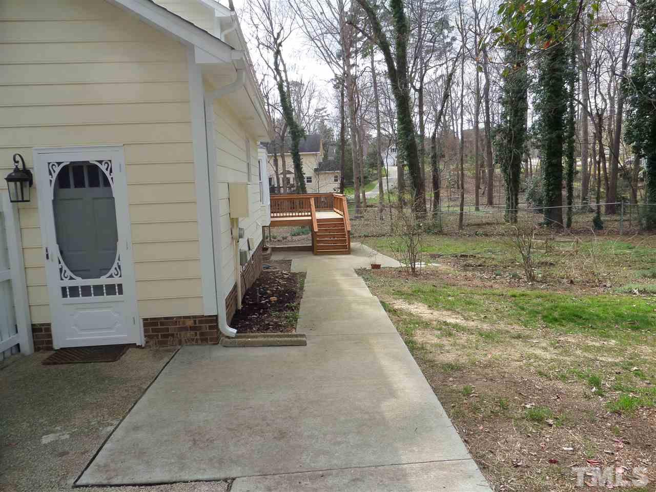 8725 Windjammer Drive Raleigh, NC 27615 - Photo 18 of 25 Replaced patio and concrete sidewalk from garage utility door,