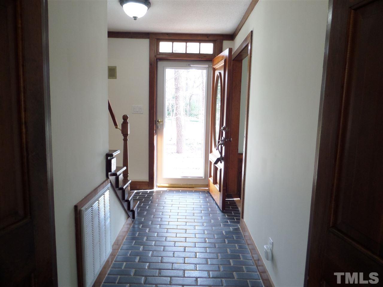 8725 Windjammer Drive Raleigh, NC 27615 - Photo 3 of 25 tile floors in foyer