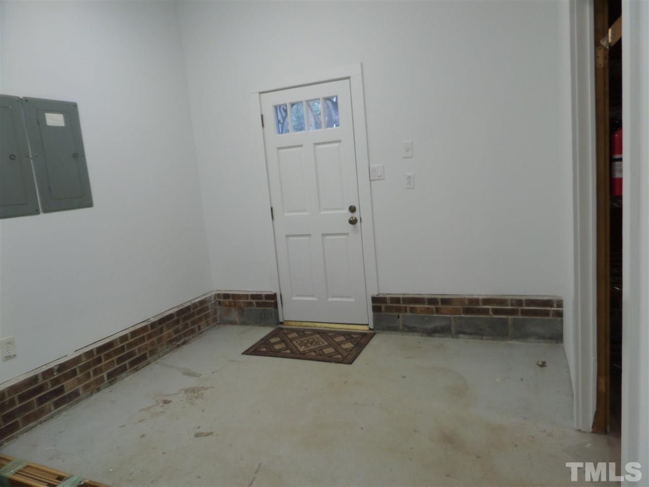 8725 Windjammer Drive Raleigh, NC 27615 - Photo 24 of 25 garage extra storage or workroom