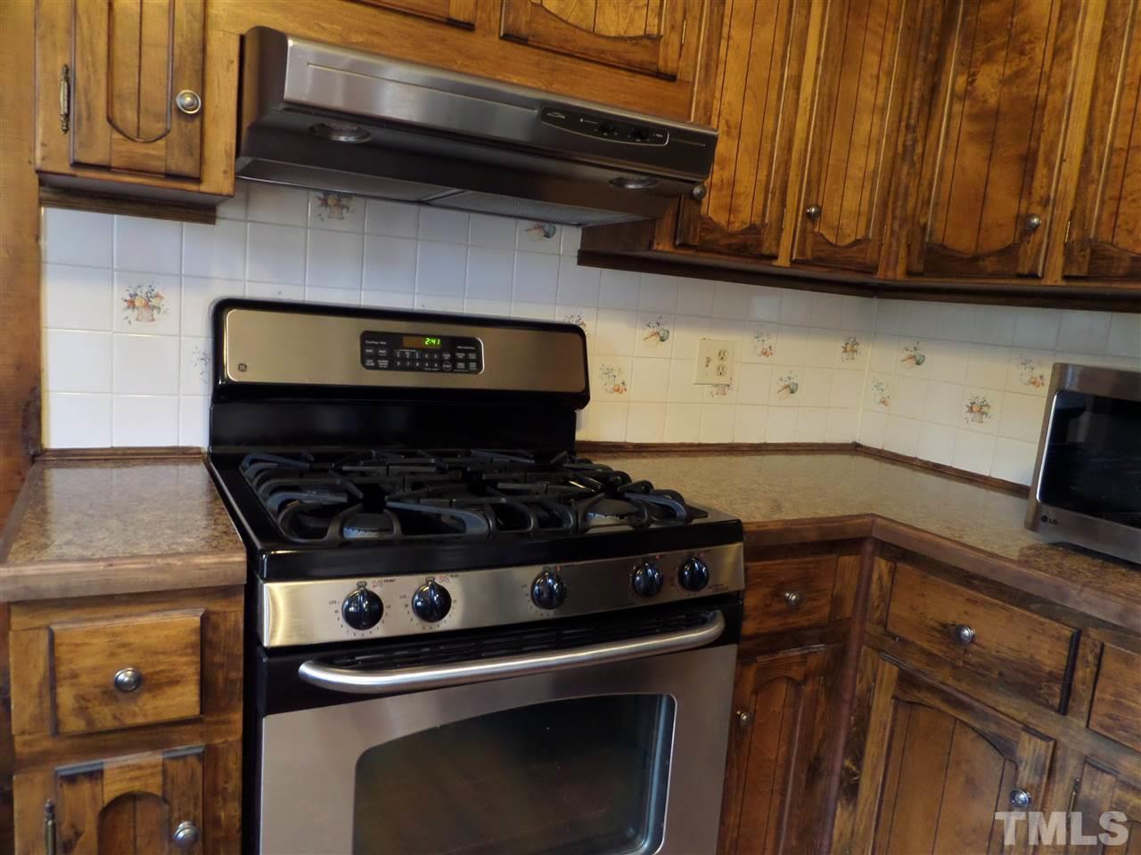 8725 Windjammer Drive Raleigh, NC 27615 - Photo 6 of 25 Gas range and new counter top