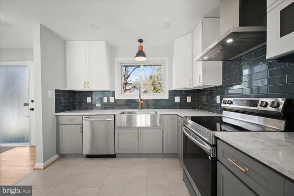 a kitchen with a stove and a sink