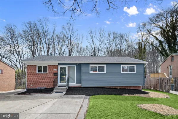 a kitchen with cabinets and window