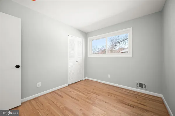a bathroom with a sink toilet a mirror and shower