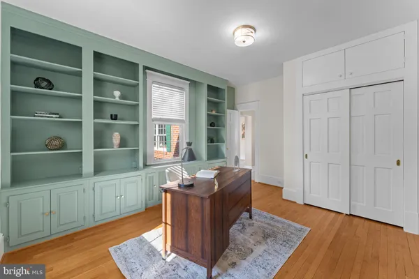 a kitchen with a sink a stove and cabinets