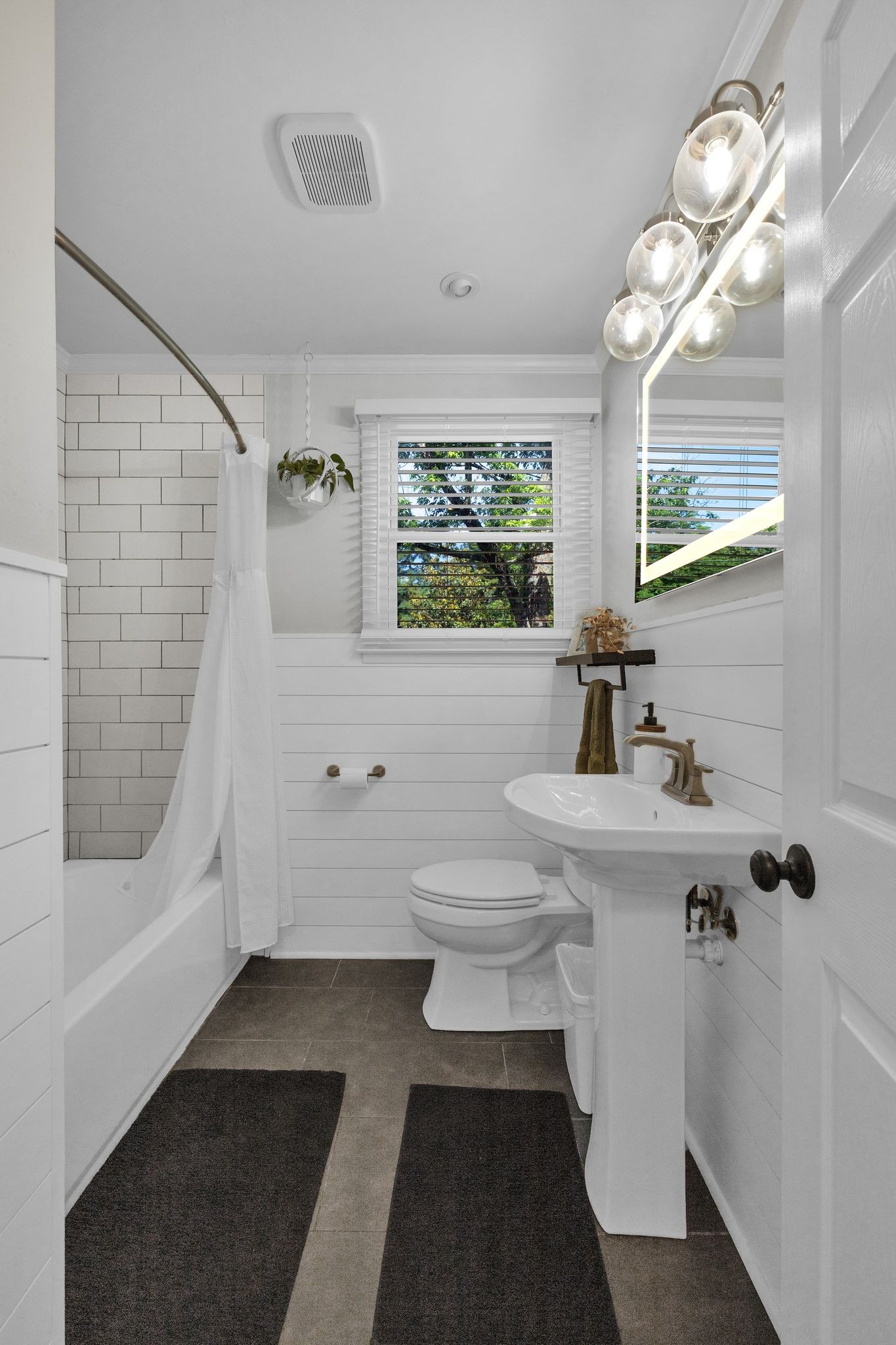1610 Leaf Avenue Murfreesboro, TN 37130 - Photo 14 of 31 a bathroom with a sink a toilet a mirror and shower