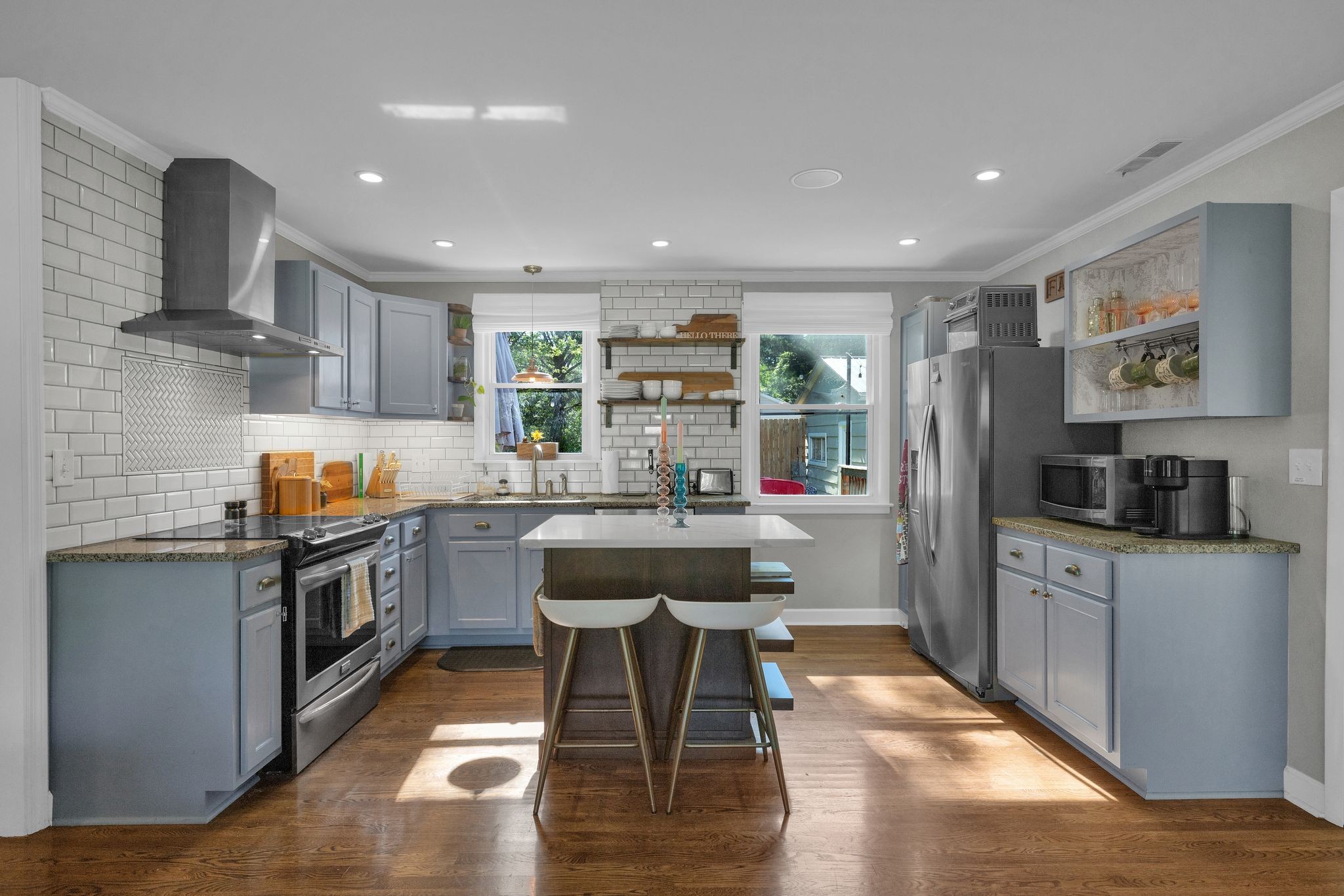 1610 Leaf Avenue Murfreesboro, TN 37130 - Photo 10 of 31 a kitchen with stainless steel appliances kitchen island granite countertop a sink and cabinets
