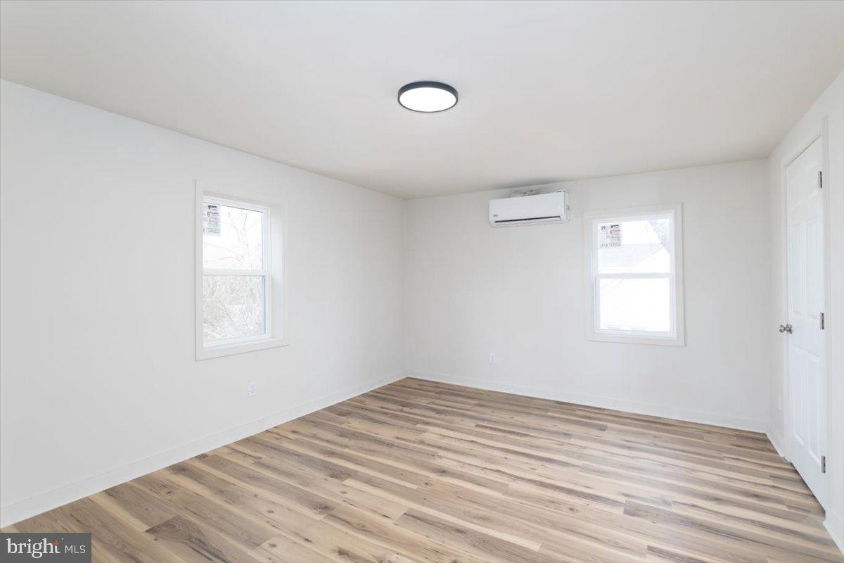 5026 Bethlehem Road Preston, MD 21655 - Photo 23 of 25 a view of empty room with wooden floor and fan