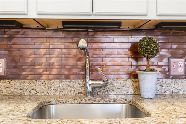 a kitchen with a sink and a stove