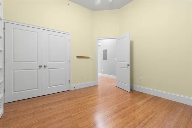 an empty room with wooden floor