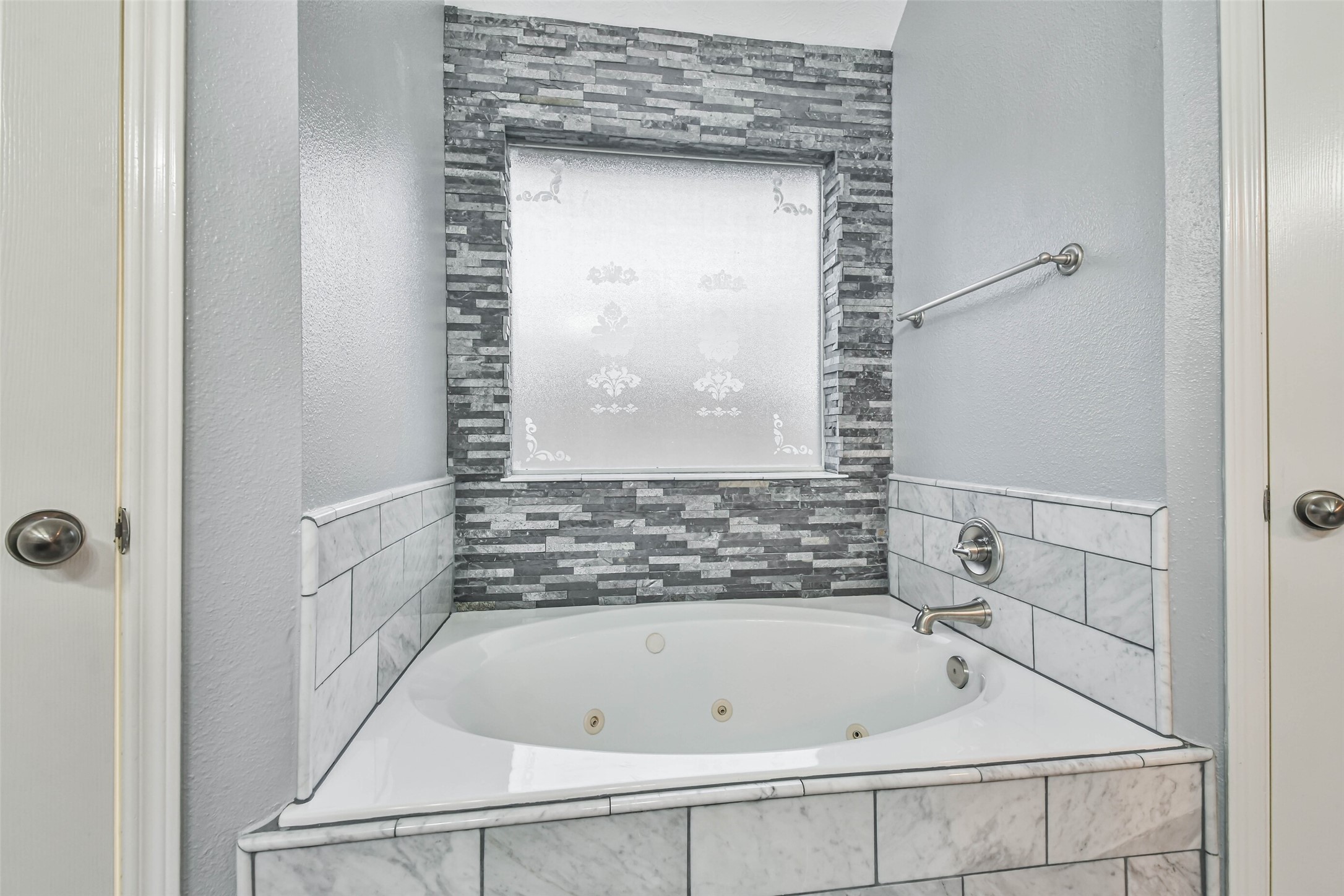 20942 Wind Field Lane Spring, TX 77379 - Photo 30 of 46 a bathroom with a tub shower and a sink