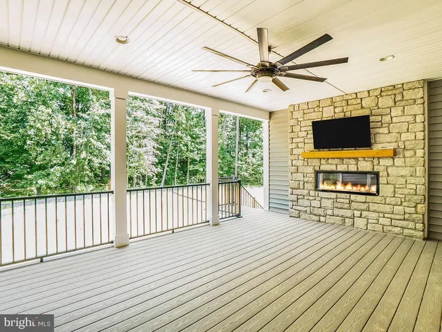 a view of kitchen and hall with wooden floor