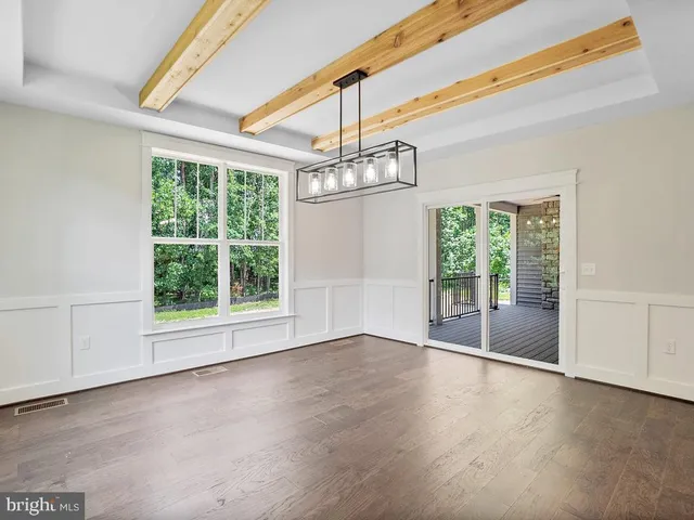 a view of swimming pool with outdoor seating and plants