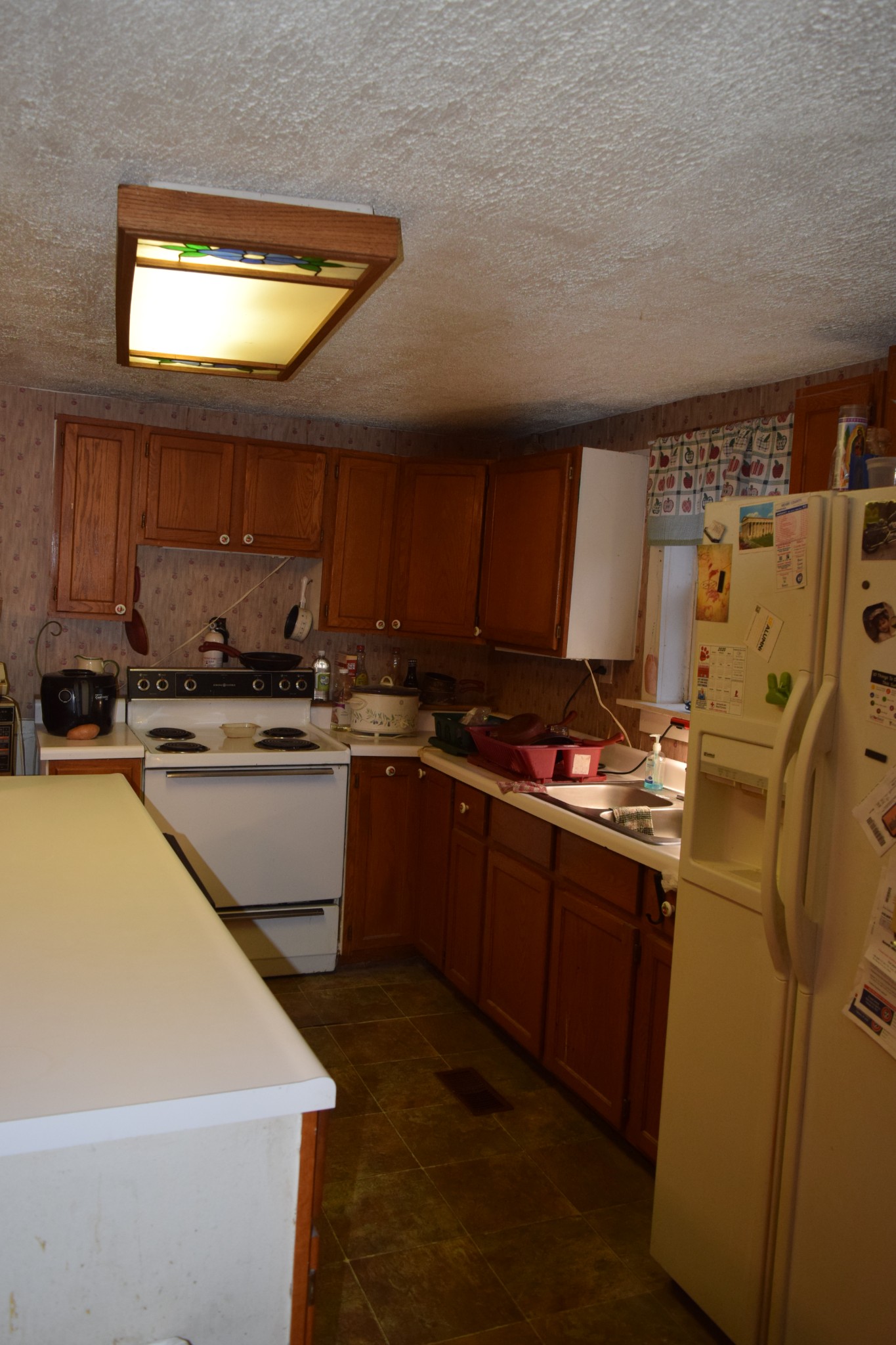 119 Cypress Road Buchanan, TN 38222 - Photo 17 of 26 a kitchen with cabinets a sink and a stove