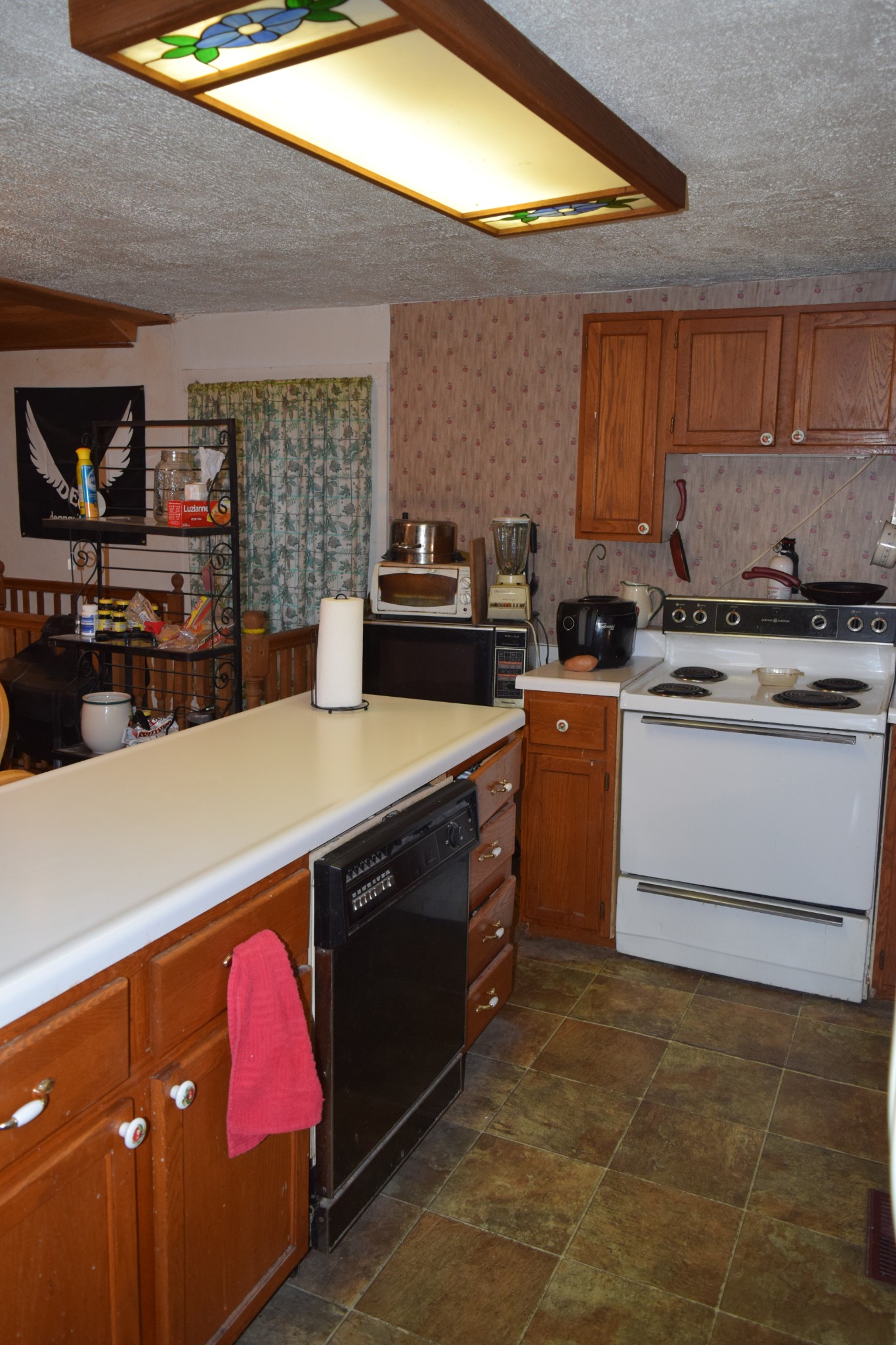 119 Cypress Road Buchanan, TN 38222 - Photo 18 of 26 a kitchen with a stove sink and cabinets