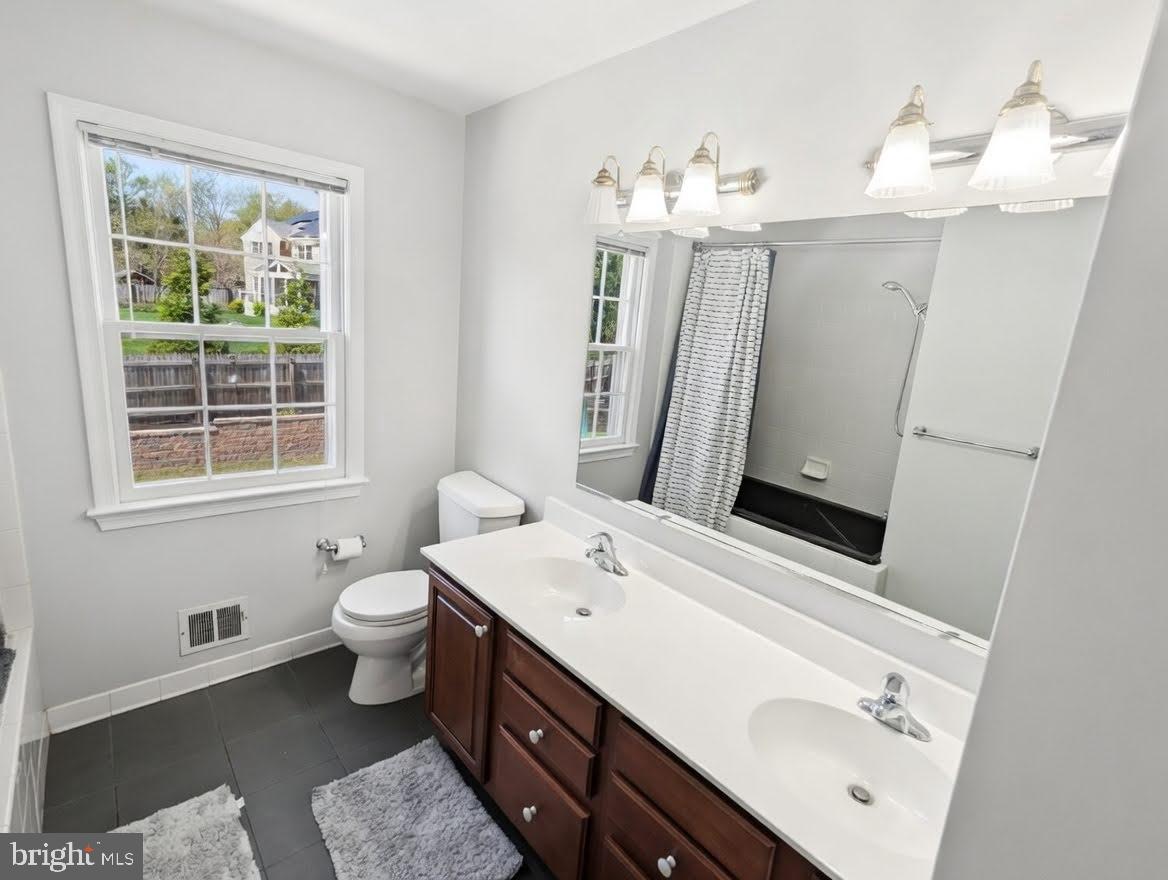1006 Kimberwicke Road McLean, VA 22102 - Photo 26 of 38 Upper-Level Bath with Dual Vanities and Jetted Tub