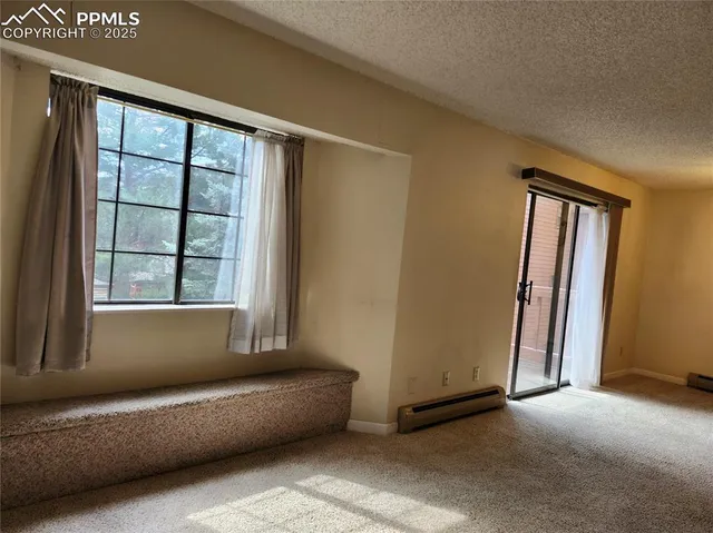 a living room with a couch and a window