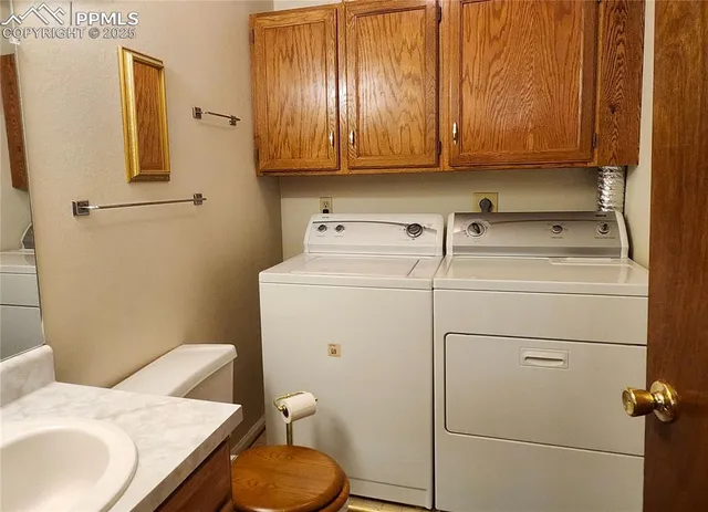 a bathroom with a sink a toilet and vanity