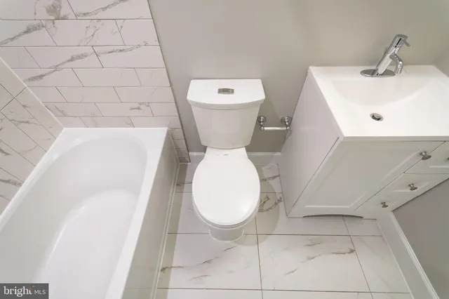 a bathroom with a sink and toilet