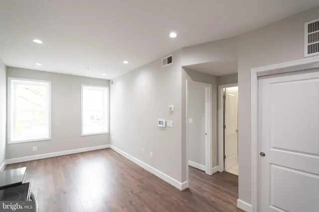 a view of entryway with wooden floor