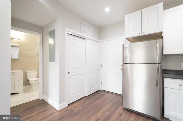 a view of bathroom with wooden floor