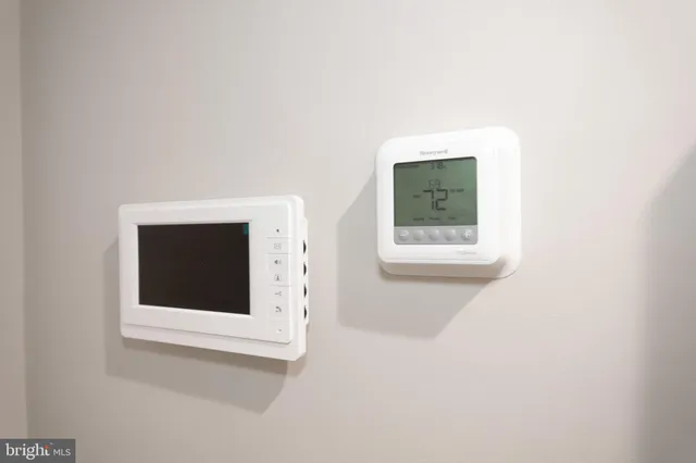 a hallway with a window and a white wall