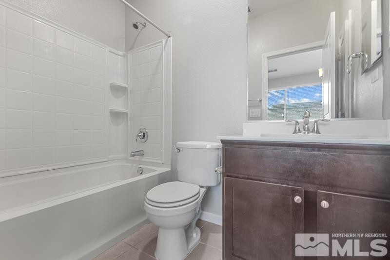 285 Mark Jeffrey Lane Reno, NV 89503 - Photo 11 of 16 a bathroom with a sink a toilet and shower