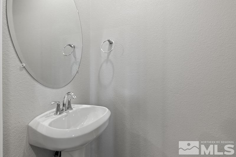 285 Mark Jeffrey Lane Reno, NV 89503 - Photo 5 of 16 a bathroom with a sink and a mirror