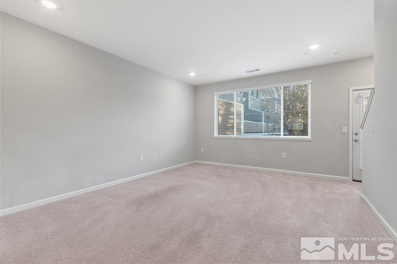 285 Mark Jeffrey Lane Reno, NV 89503 - Photo 7 of 16 an empty room with windows