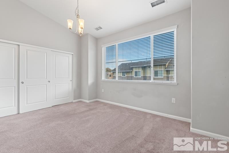 285 Mark Jeffrey Lane Reno, NV 89503 - Photo 10 of 16 a view of an empty room with a window